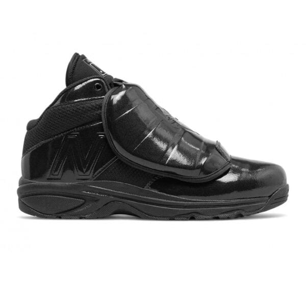 A pair of black sneakers with a zipper.