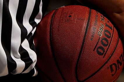 A basketball and referee 's flag are shown.