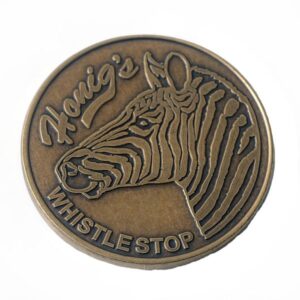 A coin with the name of " howie 's whistlestop ".