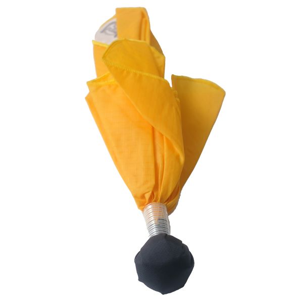A yellow umbrella with black handle and white top.