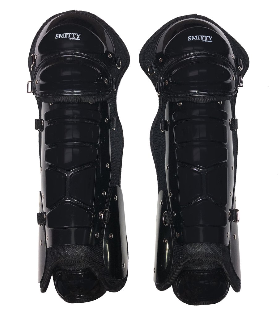 A pair of black shin guards on top of each other.