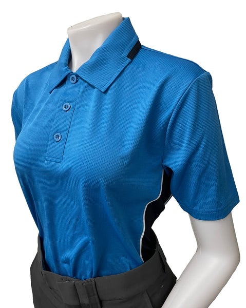 A woman wearing a blue shirt and black pants.