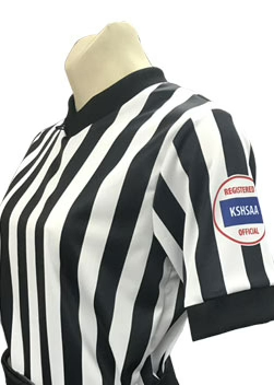 A referee shirt with the kspaa logo on it.