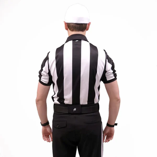 A referee is wearing his uniform and hat.