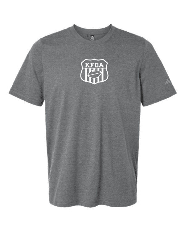 A gray t-shirt with a shield logo on it.